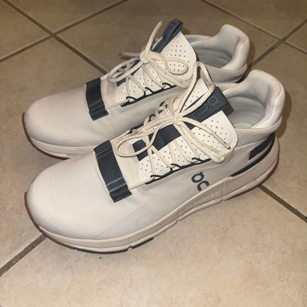 On Running White and Green Athletic Shoes